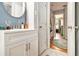 Bathroom featuring a sink with storage and view to a hall at 2785 Toney Dr, Decatur, GA 30032