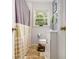 Cozy bathroom featuring a shower, vanity, toilet, and natural light from the window at 2785 Toney Dr, Decatur, GA 30032