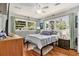 Well-lit bedroom featuring hardwood floors, neutral tones, and multiple windows at 2785 Toney Dr, Decatur, GA 30032