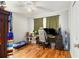 Bedroom featuring hardwood floors, ceiling fan, and ample space for study at 2785 Toney Dr, Decatur, GA 30032