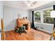 Bright bedroom with wood floors, desk, ceiling fan, and natural light at 2785 Toney Dr, Decatur, GA 30032