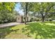This beautiful home has a spacious yard, a driveway, and a classic brick and white exterior at 2785 Toney Dr, Decatur, GA 30032