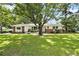 Charming home featuring a well-manicured lawn and a classic brick and white exterior at 2785 Toney Dr, Decatur, GA 30032