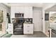 Cozy kitchen featuring modern appliances, granite countertops, and ample cabinet space at 2785 Toney Dr, Decatur, GA 30032