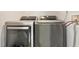 Modern laundry room featuring stainless steel washer and dryer at 2785 Toney Dr, Decatur, GA 30032
