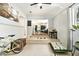Bright sitting room with white brick walls, tiled floor, and steps leading to the living room at 2785 Toney Dr, Decatur, GA 30032