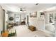 Bright sun room featuring neutral tones, tile floors and a large opening to another room at 2785 Toney Dr, Decatur, GA 30032