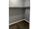 Walk-in closet with wooden-look floors and white trim baseboards at 3575 Oakvale Rd # 305, Decatur, GA 30034