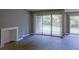 Bright living room featuring wood floors and sliding glass doors leading to the outdoor patio at 3575 Oakvale Rd # 305, Decatur, GA 30034