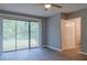 Living room showing large sliding glass doors and a closet at 3575 Oakvale Rd # 305, Decatur, GA 30034
