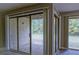Living room featuring sliding glass doors offering natural light and views of the outdoor area at 3575 Oakvale Rd # 305, Decatur, GA 30034
