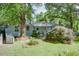 Charming single-story home with a well-manicured front yard and mature trees at 4236 Florida Nw Ave, Atlanta, GA 30360