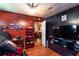 Cozy living room featuring red wood paneling, cabinets, and television at 4236 Florida Nw Ave, Atlanta, GA 30360