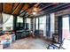 Cozy living room featuring a ceiling fan, wood plank walls, and a large television at 4236 Florida Nw Ave, Atlanta, GA 30360