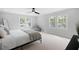 Serene bedroom with ample natural light, soft carpet, and minimalist decor at 1251 Pierce Ave, Smyrna, GA 30080