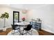 Elegant dining area with modern lighting, furniture, and convenient outdoor access at 1251 Pierce Ave, Smyrna, GA 30080