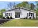Charming single-story home with gray siding, dark shutters, well-manicured landscaping, and inviting entrance at 1251 Pierce Ave, Smyrna, GA 30080