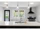 Bright kitchen featuring a large island with seating, modern appliances, and designer backsplash at 1251 Pierce Ave, Smyrna, GA 30080