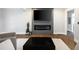 Modern living room featuring an electric fireplace, TV, hardwood floors, and contemporary decor at 1251 Pierce Ave, Smyrna, GA 30080