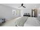 Bright main bedroom features plush carpet, ceiling fan, and ensuite bath access at 1251 Pierce Ave, Smyrna, GA 30080
