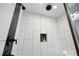 Modern shower with custom tile and built-in niche provides a spa-like experience at 1251 Pierce Ave, Smyrna, GA 30080