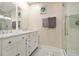 Modern bathroom featuring double sinks, sleek vanity, and a glass-enclosed shower at 361 Adelle Se St, Atlanta, GA 30315