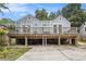 Backyard view of a cozy cottage house with a large wooden deck at 361 Adelle Se St, Atlanta, GA 30315