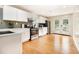Well-lit kitchen with white cabinetry, stainless steel appliances, and french doors at 361 Adelle Se St, Atlanta, GA 30315