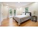 Serene main bedroom featuring hardwood floors, ample natural light, and access to a private balcony at 361 Adelle Se St, Atlanta, GA 30315