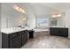 Bathroom with double vanities, a bathtub, and a large window at 4105 Vista Pointe Dr, Cumming, GA 30028