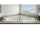 Bathroom with a large bathtub and a view from the window at 4105 Vista Pointe Dr, Cumming, GA 30028