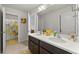 Bathroom featuring double sinks, white countertop, and modern fixtures at 4105 Vista Pointe Dr, Cumming, GA 30028