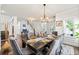 Formal dining area with a large table, elegant chairs, and ample natural light at 4105 Vista Pointe Dr, Cumming, GA 30028