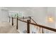 Hallway with wood railing and large windows at 4105 Vista Pointe Dr, Cumming, GA 30028