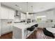 Bright kitchen with an island, white cabinets, stainless steel appliances, and pendant lighting at 4105 Vista Pointe Dr, Cumming, GA 30028