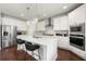 Contemporary kitchen featuring white cabinetry, a large island, and stainless steel appliances at 4105 Vista Pointe Dr, Cumming, GA 30028