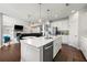 Bright, open kitchen with white cabinets, stainless steel appliances, and a large center island at 4105 Vista Pointe Dr, Cumming, GA 30028