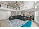 Open-concept living space with a high ceiling, a loft area, and a large sectional sofa at 4105 Vista Pointe Dr, Cumming, GA 30028