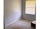 A basic bedroom with a window and light-colored walls at 1487 Colony East Cir, Stone Mountain, GA 30083