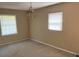 A bedroom with two windows and carpeted floors at 1487 Colony East Cir, Stone Mountain, GA 30083