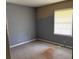 A bedroom featuring light blue walls and a window at 1487 Colony East Cir, Stone Mountain, GA 30083