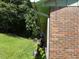 Home exterior with brick wall and lush green lawn at 1487 Colony East Cir, Stone Mountain, GA 30083