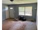 A living room with a window and a white front door at 1487 Colony East Cir, Stone Mountain, GA 30083