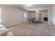 Spacious carpeted basement with a ping pong table, exterior access, and a neutral color palette provides ample room for activities at 2183 Trinity Grove Ct, Dacula, GA 30019