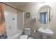 Standard bathroom with tub/shower combo, toilet, and vanity offers essential amenities and a clean, functional design at 2183 Trinity Grove Ct, Dacula, GA 30019