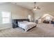 Expansive bedroom with carpet, high ceilings, a ceiling fan, and large windows offers natural light and comfort at 2183 Trinity Grove Ct, Dacula, GA 30019