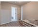 Spare bedroom with modern carpet, standard closet doors, and nearby entertainment center offers essential living space at 2183 Trinity Grove Ct, Dacula, GA 30019