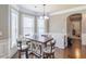 Cozy breakfast nook featuring a charming table setting, natural light, and hardwood floors, perfect for casual dining at 2183 Trinity Grove Ct, Dacula, GA 30019