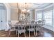 Chic dining room features coffered ceilings, an elegant chandelier, and designer furnishings, perfect for stylish entertaining at 2183 Trinity Grove Ct, Dacula, GA 30019