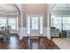 Elegant foyer with hardwood floors, wainscoting, and arched doorways, leading to bright living spaces at 2183 Trinity Grove Ct, Dacula, GA 30019